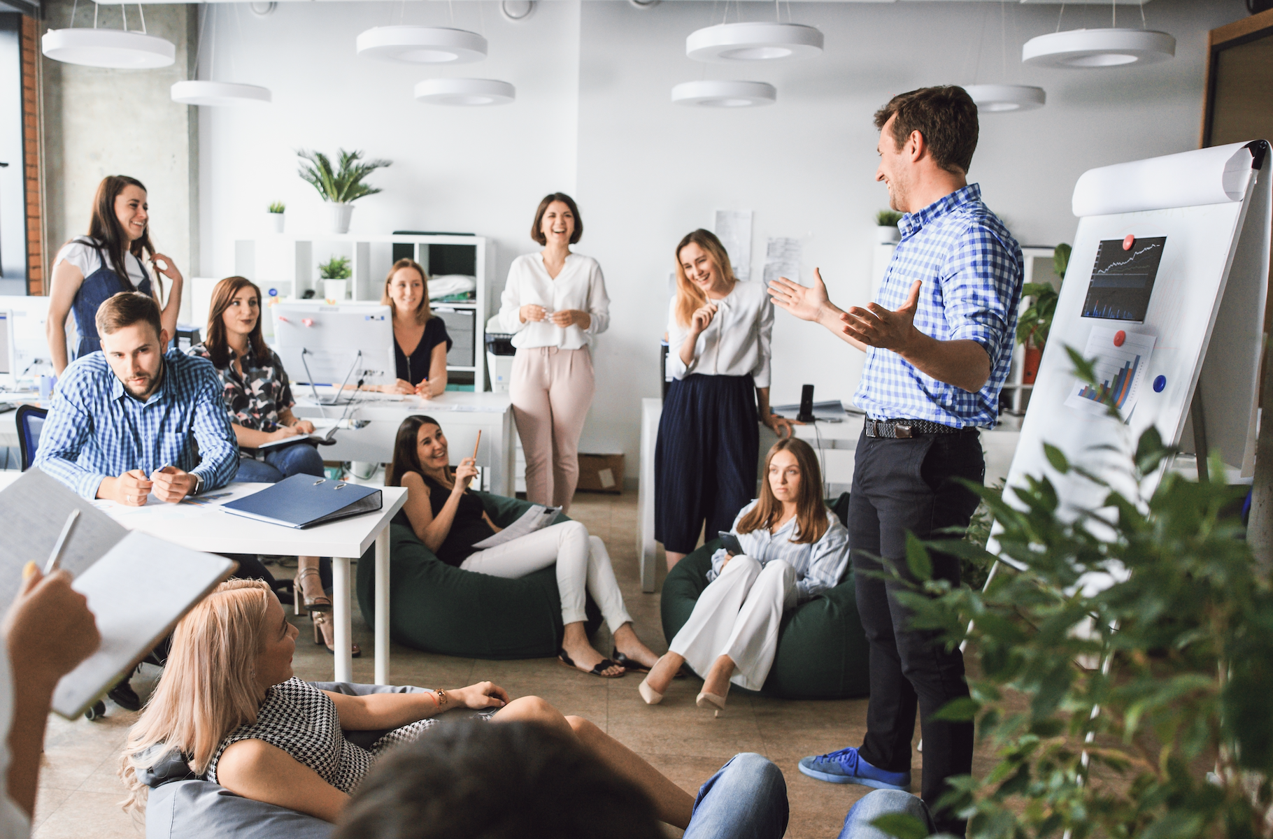 Team gathered for a town hall meeting in the office