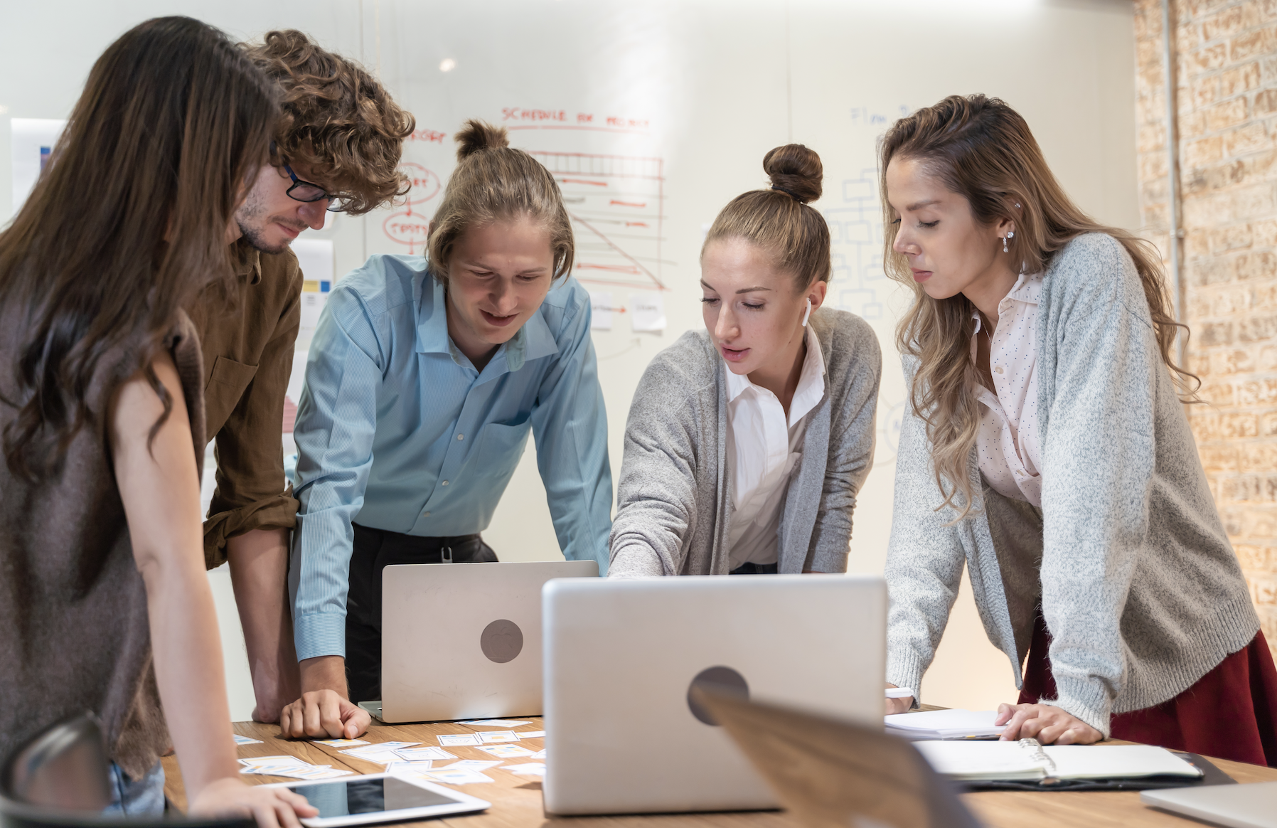 Team collaboration around a whiteboard